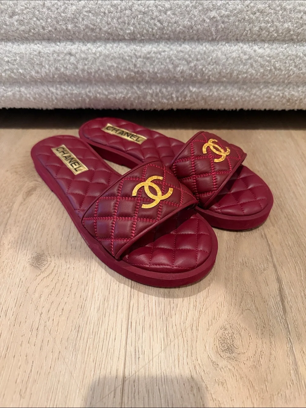 CHANEL Quilted Burgundy Slide Mules with Gold CC Emblem